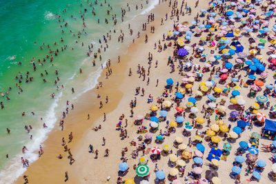 High angle view of group of people on beach