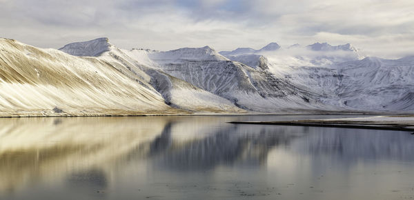 Scenic view of lake against mountain range