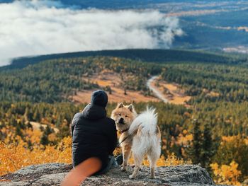 Rear view of woman standing on field