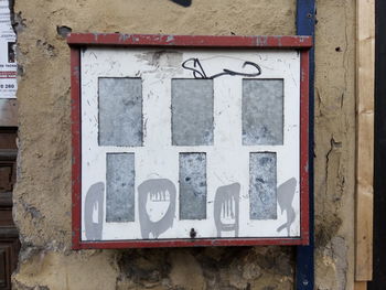 Close-up of red mailbox on wall