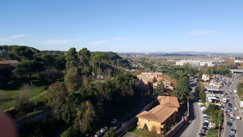 High angle view of trees and buildings against sky