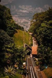 High angle view of railroad tracks amidst buildings