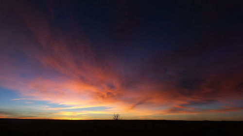 Scenic view of silhouette landscape against sky during sunset