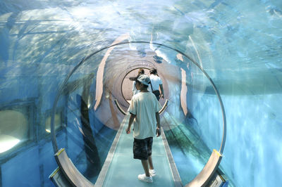 Man standing in illuminated mirror