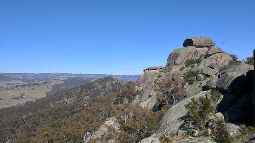 Scenic view of mountains against clear blue sky