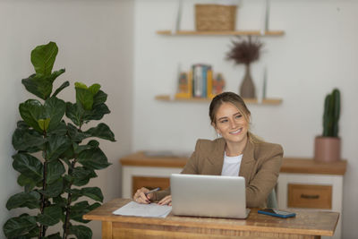 Woman working at home with laptop. home office.  notebook for working. 