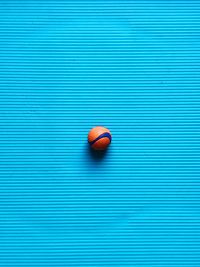 Directly above shot of ball on blue table