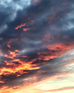 Low angle view of dramatic sky during sunset