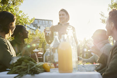 Friends having meal in garden