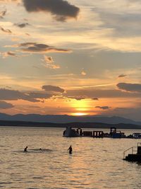 Scenic view of sea against orange sky