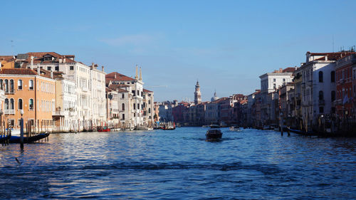 Grand canal amidst buildings against sky in city