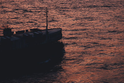 High angle view of boat on beach during sunset