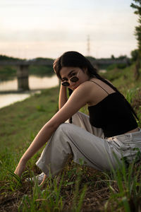 Woman sitting on field