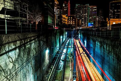 High angle view of light trails on road at night