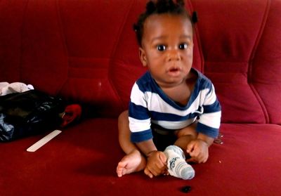 Portrait of cute boy sitting