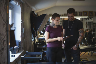 Man and woman looking at digital tablet