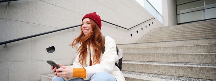 Young woman using mobile phone