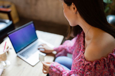 Young woman using laptop