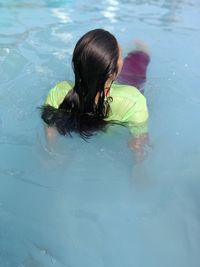 High angle view of girl swimming in pool