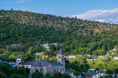 High angle view of trees and houses against sky