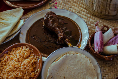 Wrapped with mole from san lucas atzala, puebla with red corn tortilla