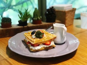 Close-up of breakfast served on table