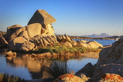 Sunset on the octopus head beach in la maddalena, sassari province, sardinia, italy, europe.