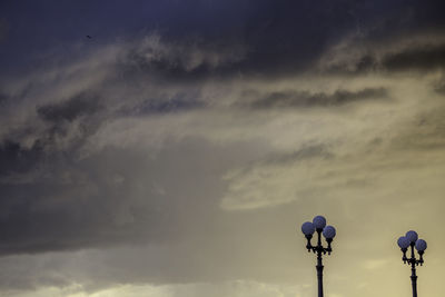 Low angle view of street light against sky