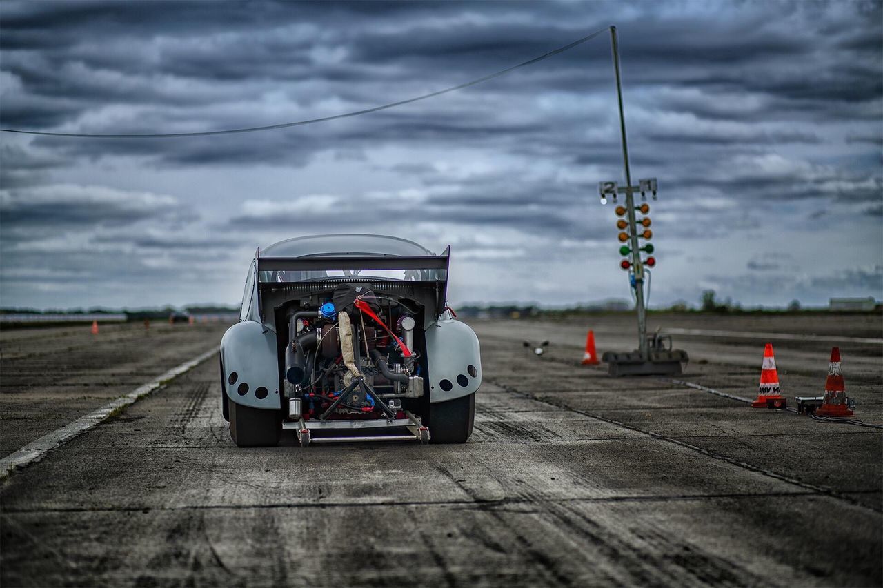 sky, cloud - sky, cloudy, transportation, cloud, road, street, mode of transport, outdoors, car, travel, land vehicle, communication, overcast, street light, weather, day, auto post production filter, guidance, red