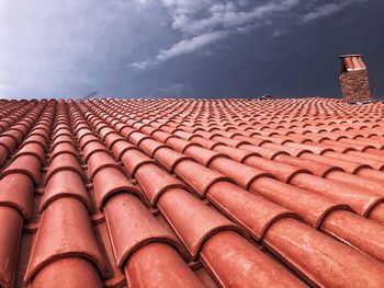 Low angle view of roof and building against sky