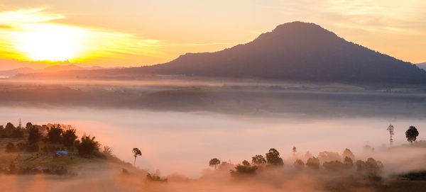 Scenic view of mountains against sky during sunset