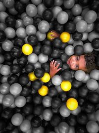 Portrait of young woman with colorful balloons