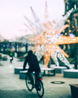 Blurred motion of person riding bicycle