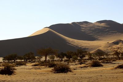 Scenic view of desert against clear sky