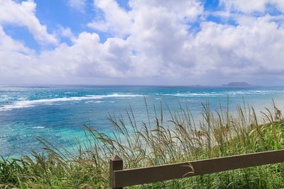 Scenic view of sea against cloudy sky