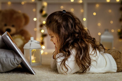 Side view of woman using mobile phone