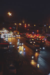 Illuminated city street at night