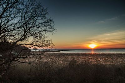 Scenic view of sea against sky at sunset