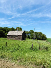 House on field against sky