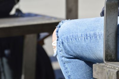 Close-up of man standing on metal