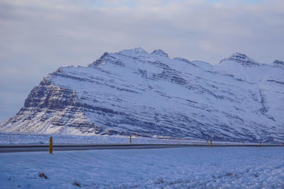 Scenic view of snow covered mountains against sky