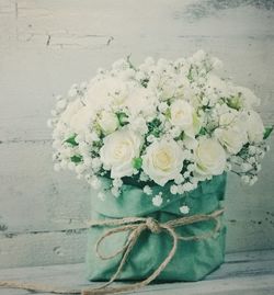 Close-up of white rose on table