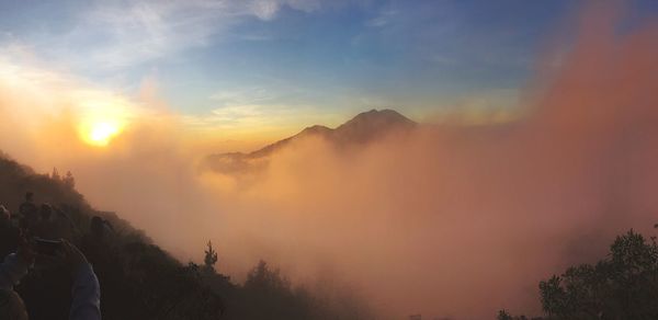 Scenic view of mountains against sky during sunset