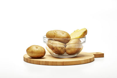 Close-up of fruits on table against white background