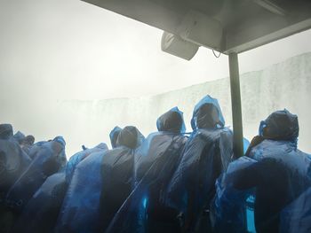 Group of people in raincoats
