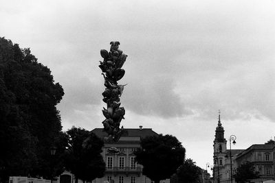 Low angle view of statue against building