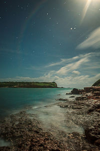 Scenic view of sea against sky at night