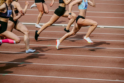 Low section of woman exercising in gym