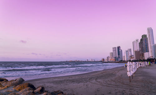 Scenic view of beach against sky during sunset