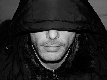 Close-up of mid adult man wearing hood